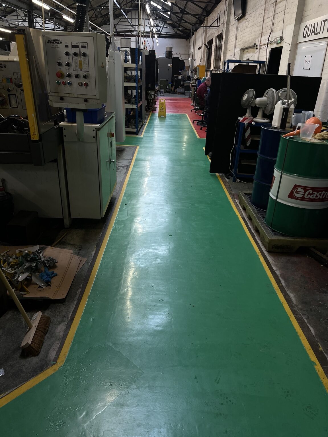 Green industrial resin aisle with line marking