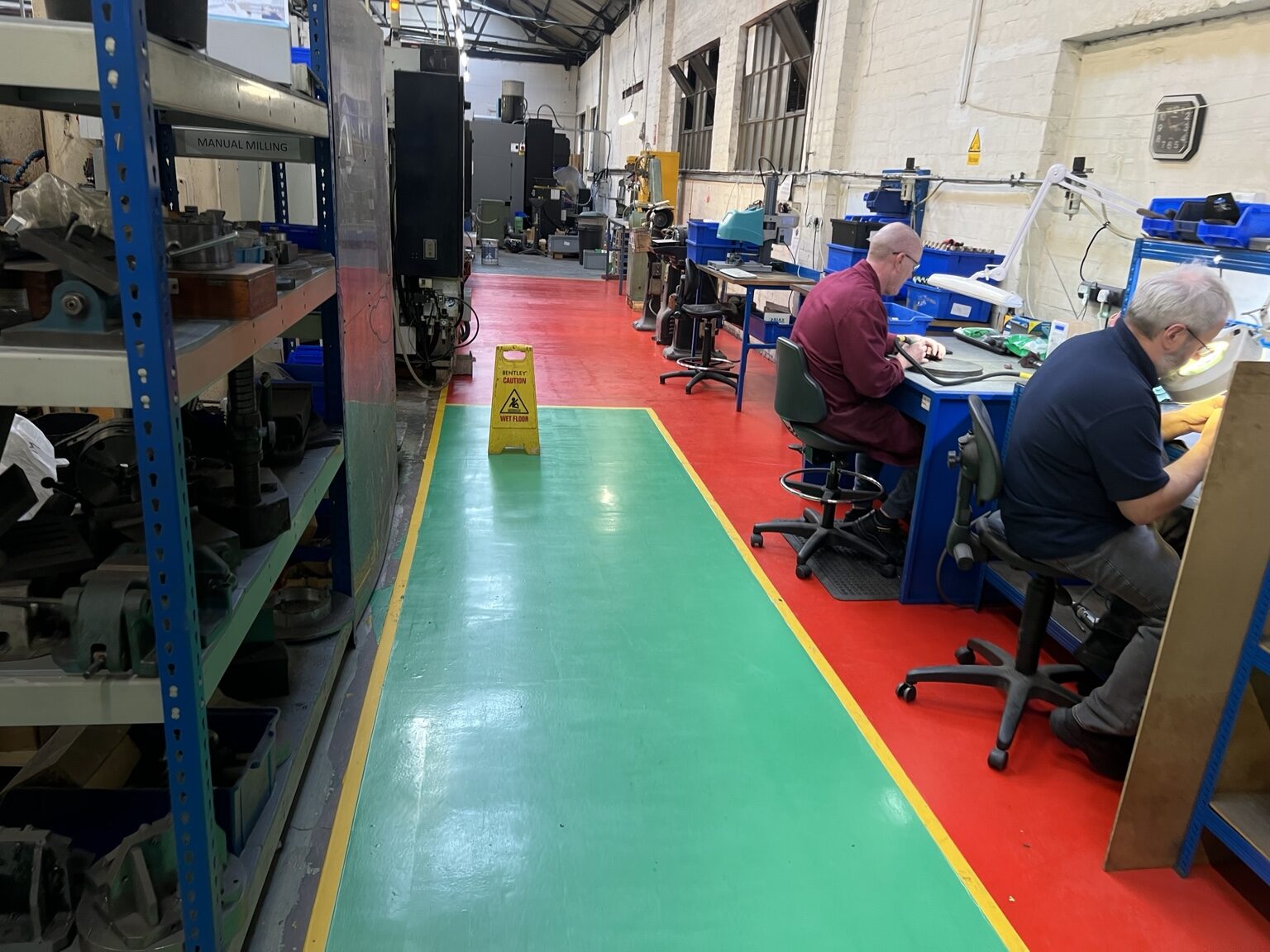 Green and red zoned workshop resin floor